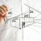 Architect drawing architectural house plan on virtual screen.